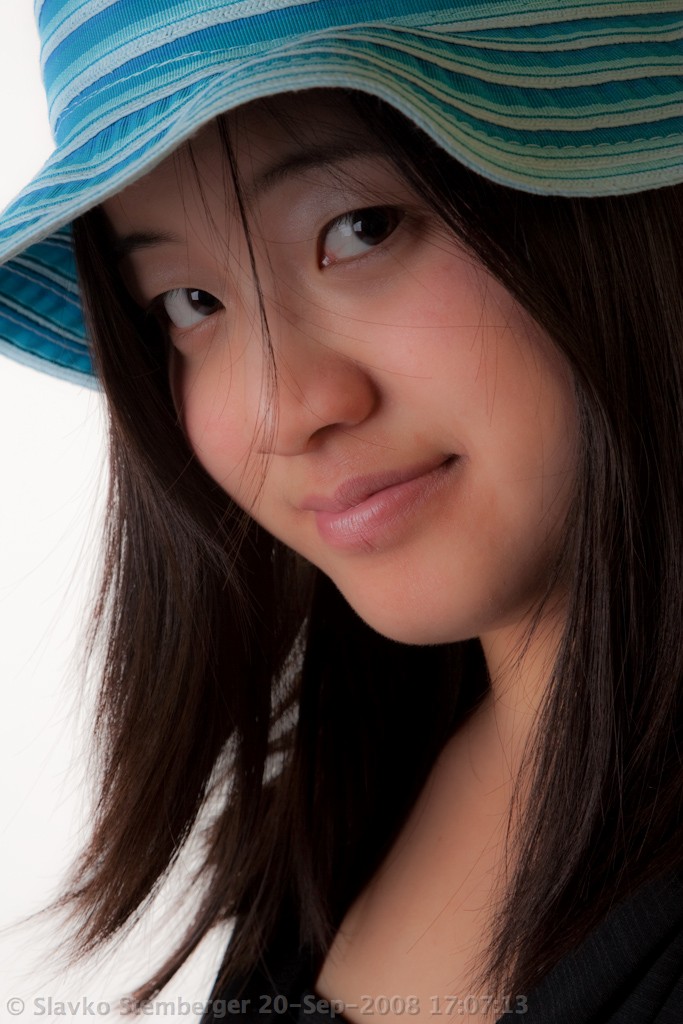Young oriental woman in hat